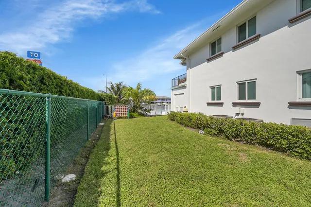 an aerial view of a house with a swimming pool