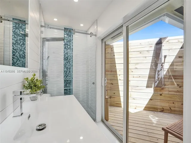 a bathroom with a bathtub and shower