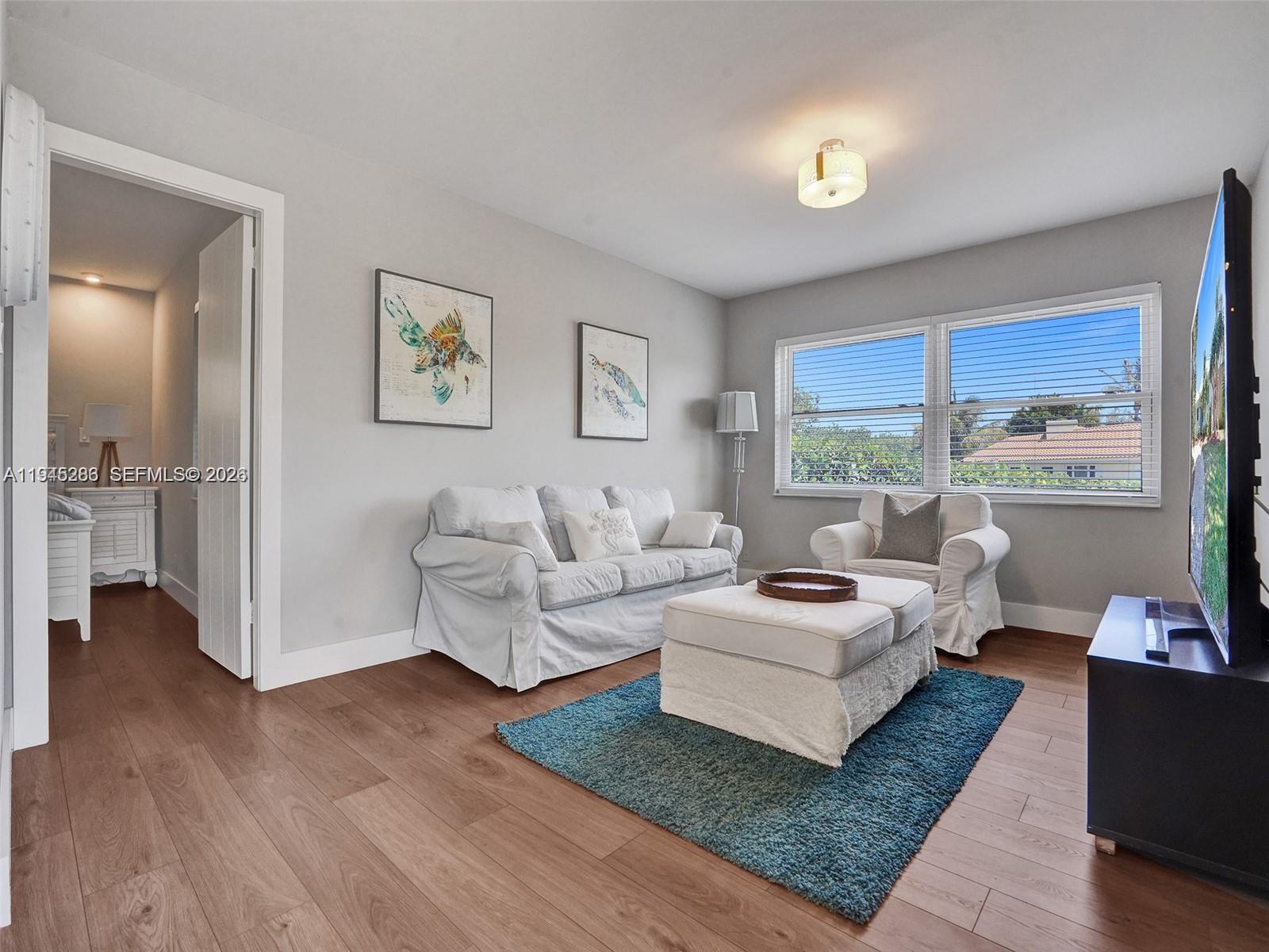 620 West Palmetto Park Road Boca Raton, FL 33486 - Photo 15 of 38 a living room with furniture and a large window