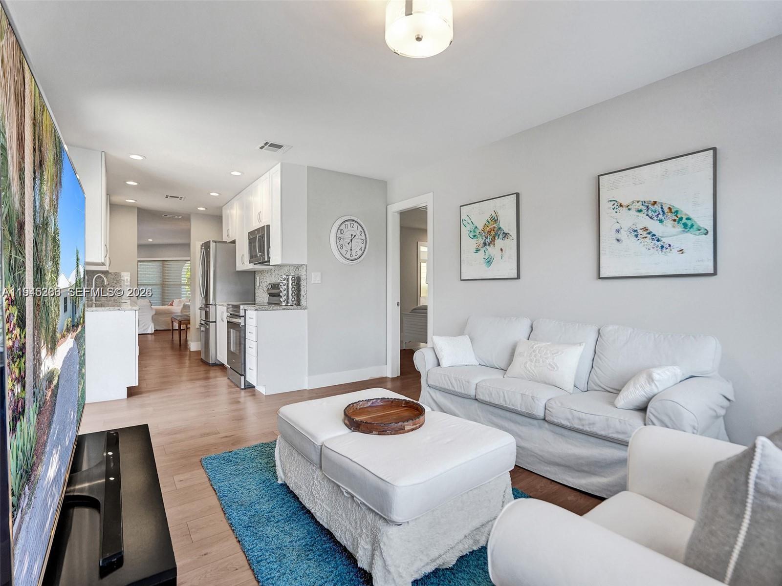 620 West Palmetto Park Road Boca Raton, FL 33486 - Photo 16 of 38 a living room with furniture and wooden floor