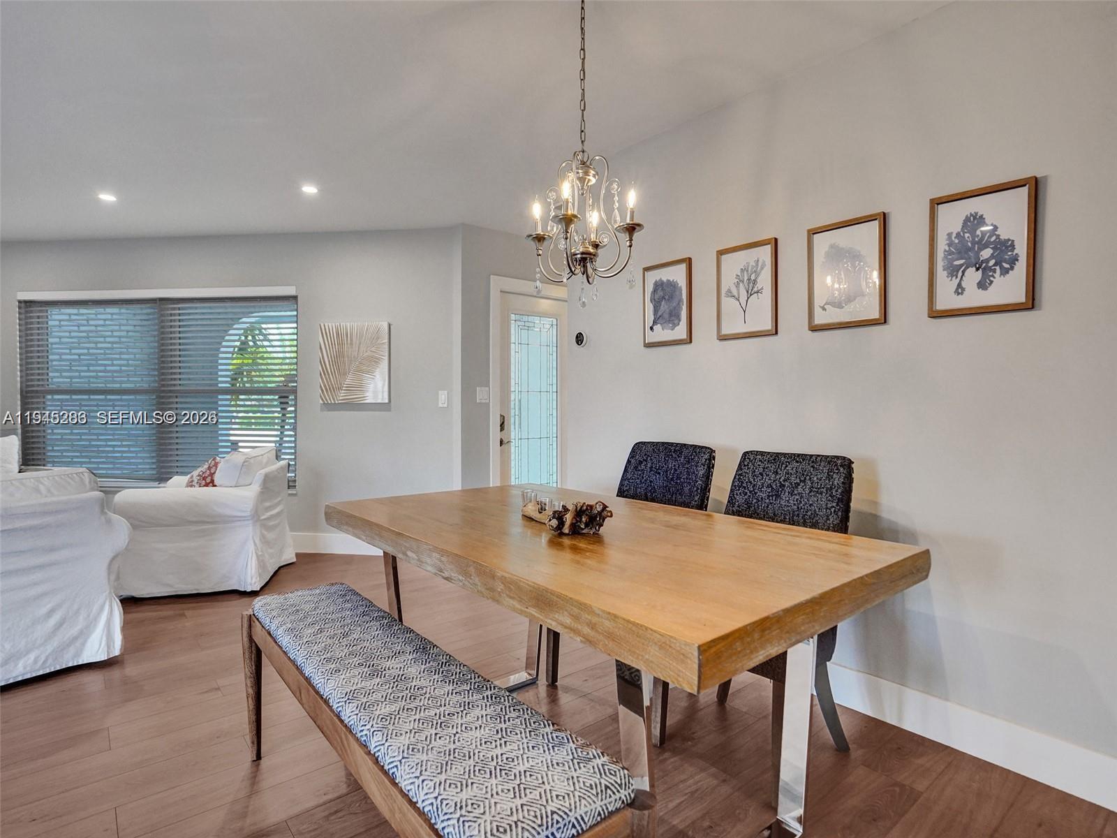 620 West Palmetto Park Road Boca Raton, FL 33486 - Photo 19 of 38 a view of a dining room with furniture window and wooden floor