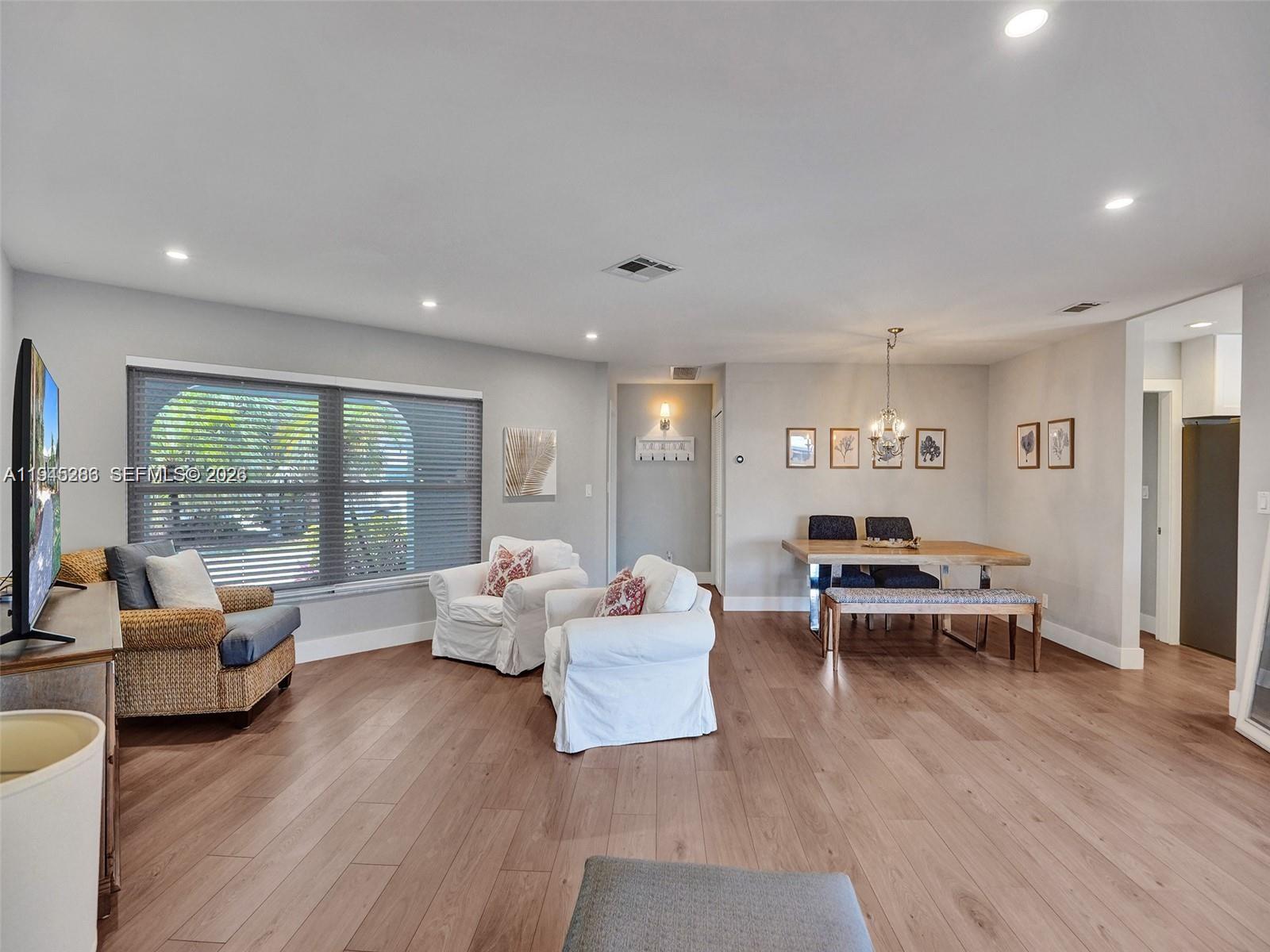 620 West Palmetto Park Road Boca Raton, FL 33486 - Photo 22 of 38 a living room with furniture and a wooden floor