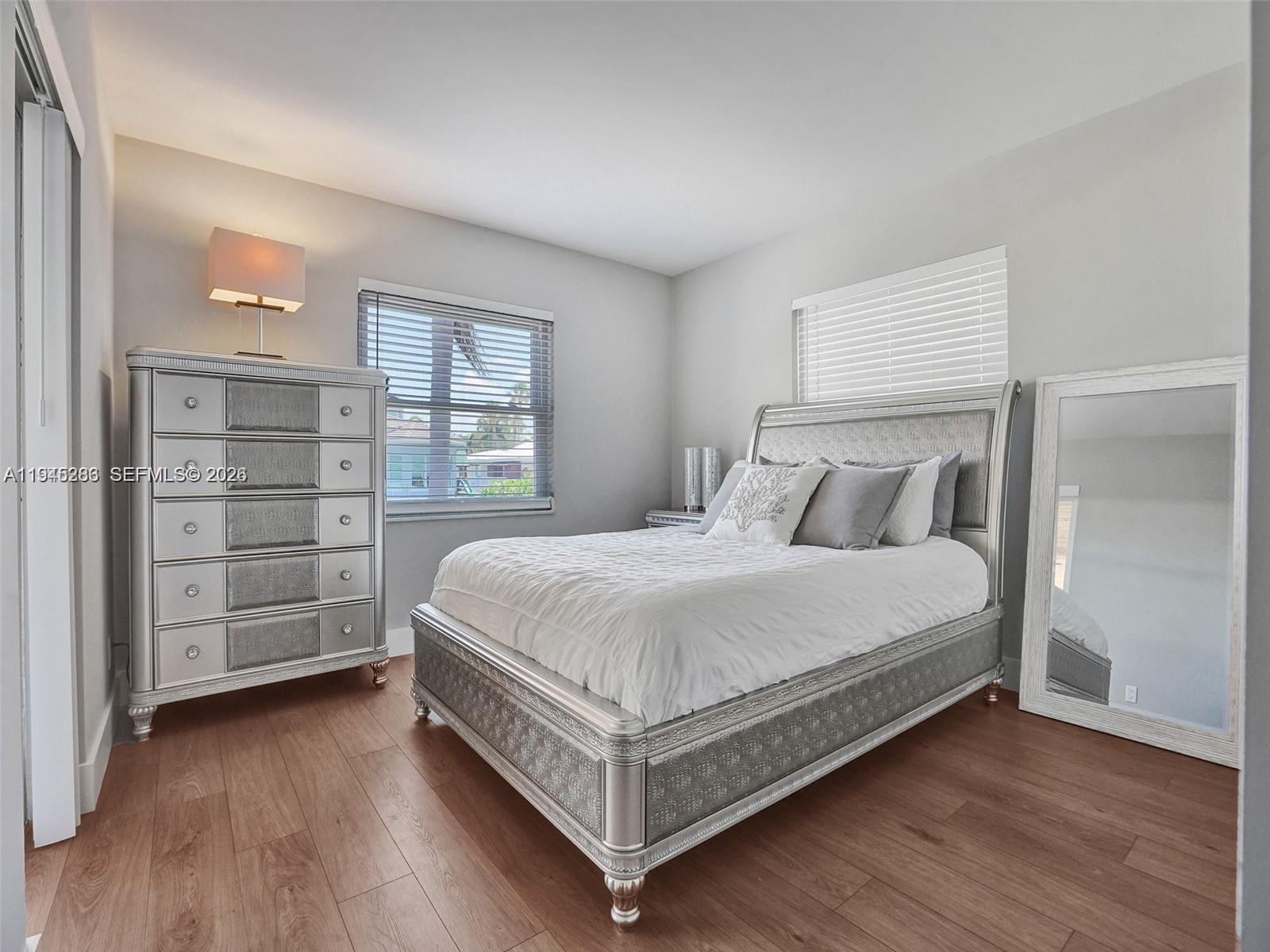 620 West Palmetto Park Road Boca Raton, FL 33486 - Photo 23 of 38 a bedroom with a bed and a window