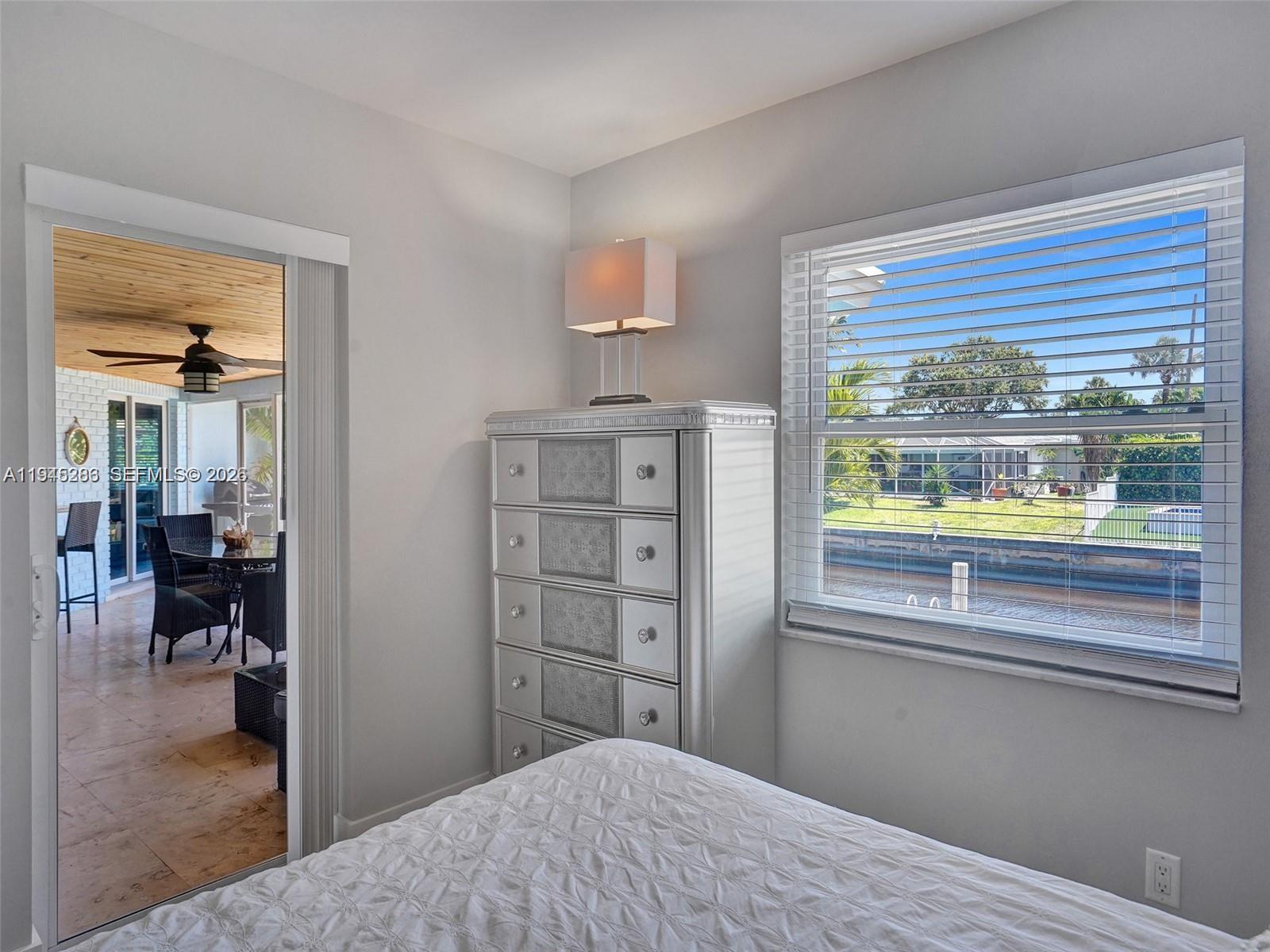 620 West Palmetto Park Road Boca Raton, FL 33486 - Photo 25 of 38 a bedroom with a bed and a window
