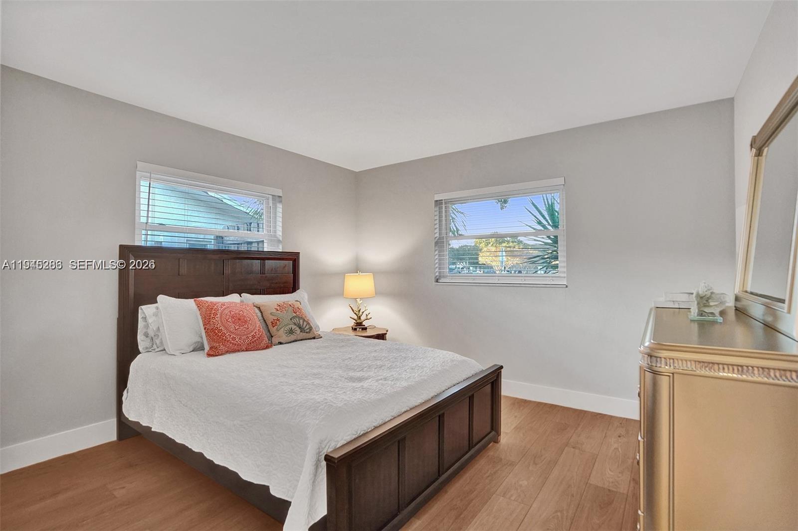 620 West Palmetto Park Road Boca Raton, FL 33486 - Photo 27 of 38 a bedroom with a bed and a couch