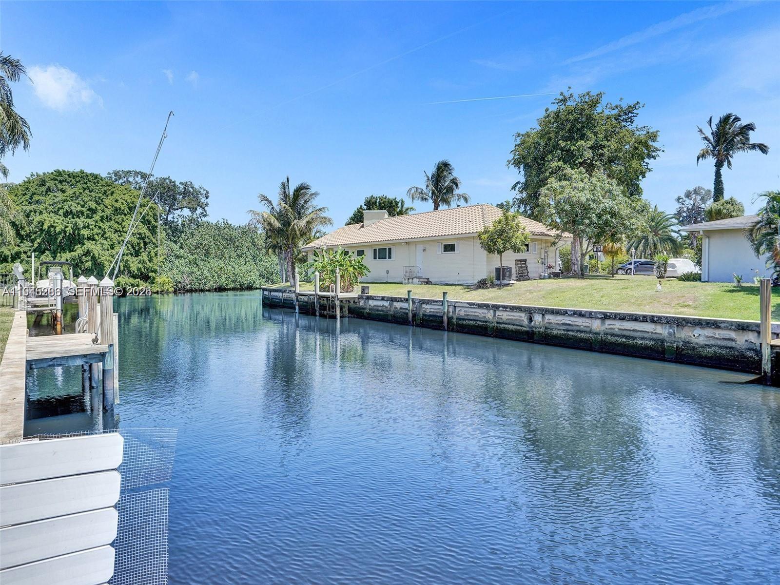 620 West Palmetto Park Road Boca Raton, FL 33486 - Photo 3 of 38 a view of a lake with houses