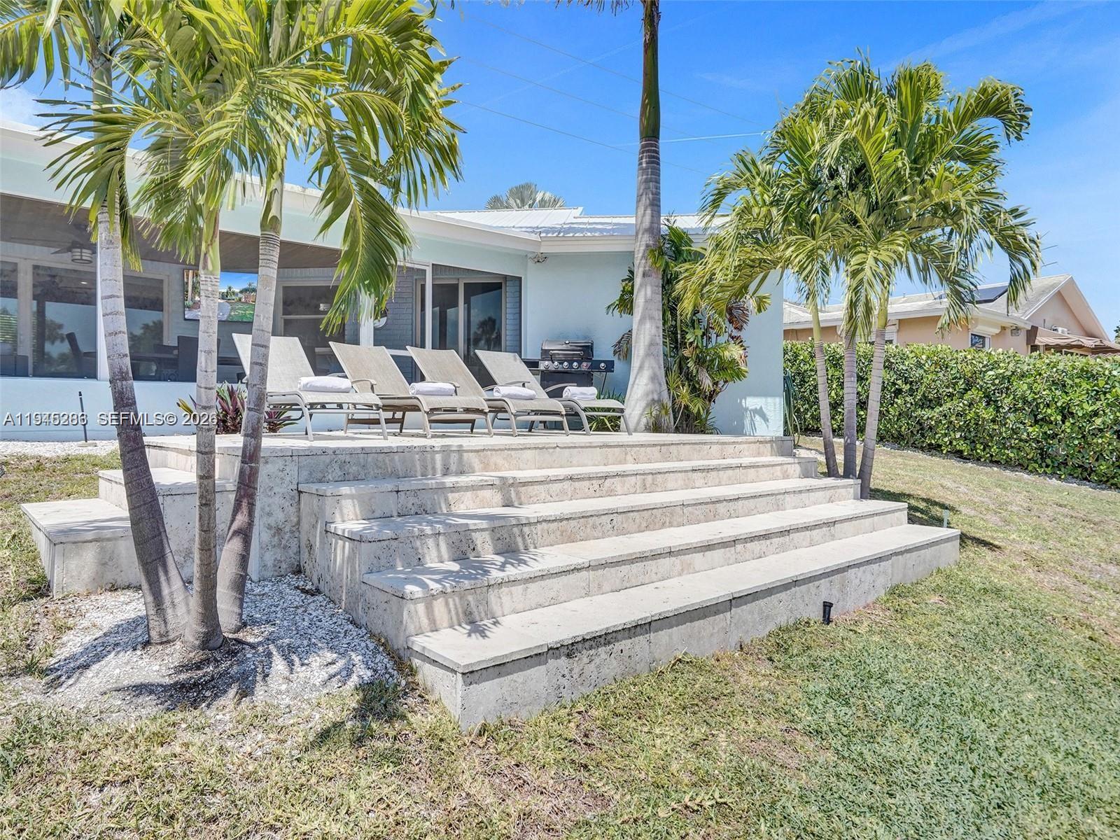 620 West Palmetto Park Road Boca Raton, FL 33486 - Photo 38 of 38 a view of a house with backyard and swimming pool