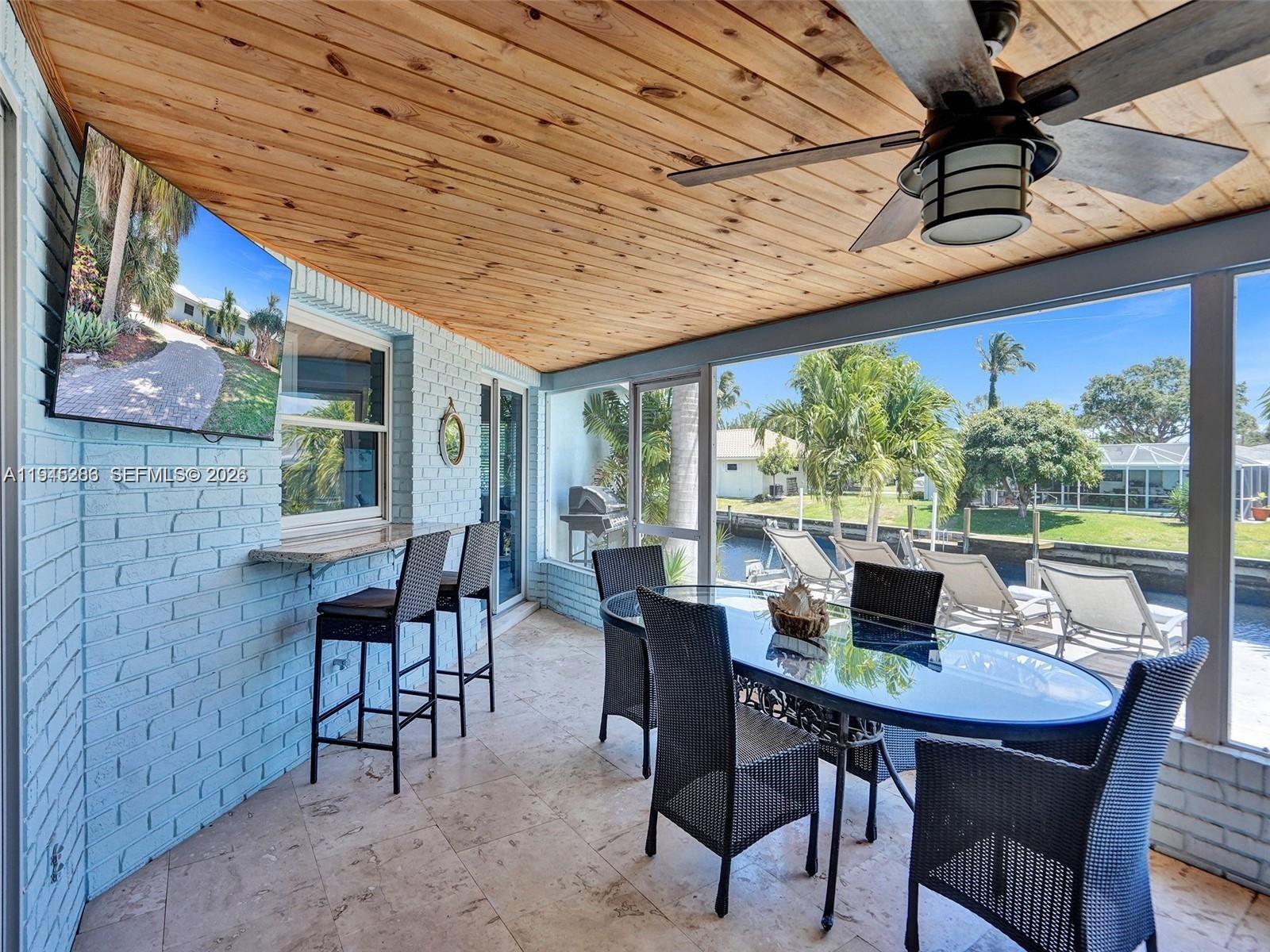 620 West Palmetto Park Road Boca Raton, FL 33486 - Photo 4 of 38 a view of a dining room with furniture window and outside view