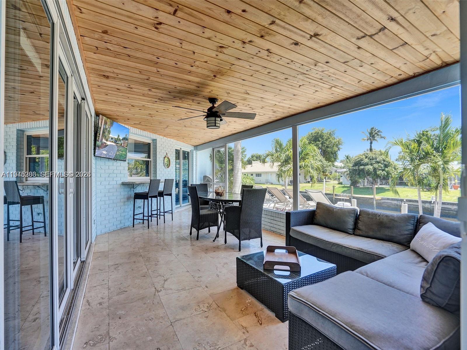 620 West Palmetto Park Road Boca Raton, FL 33486 - Photo 5 of 38 a living room with furniture and a large window