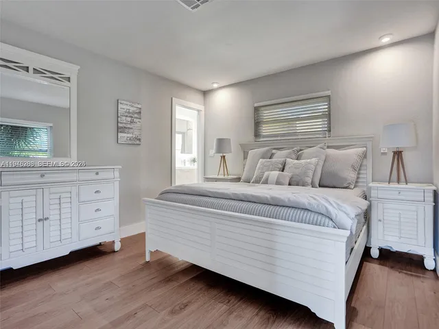 a bedroom with a bed and a dresser