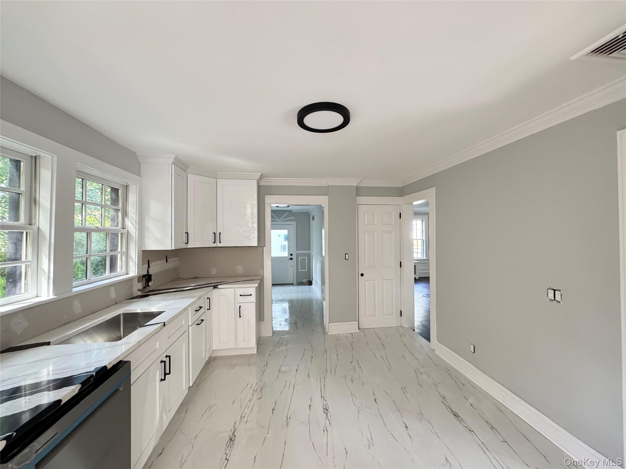 506 Midland Avenue Rye, NY 10580 - Photo 15 of 15 a large kitchen with a lot of cabinets and wooden floor