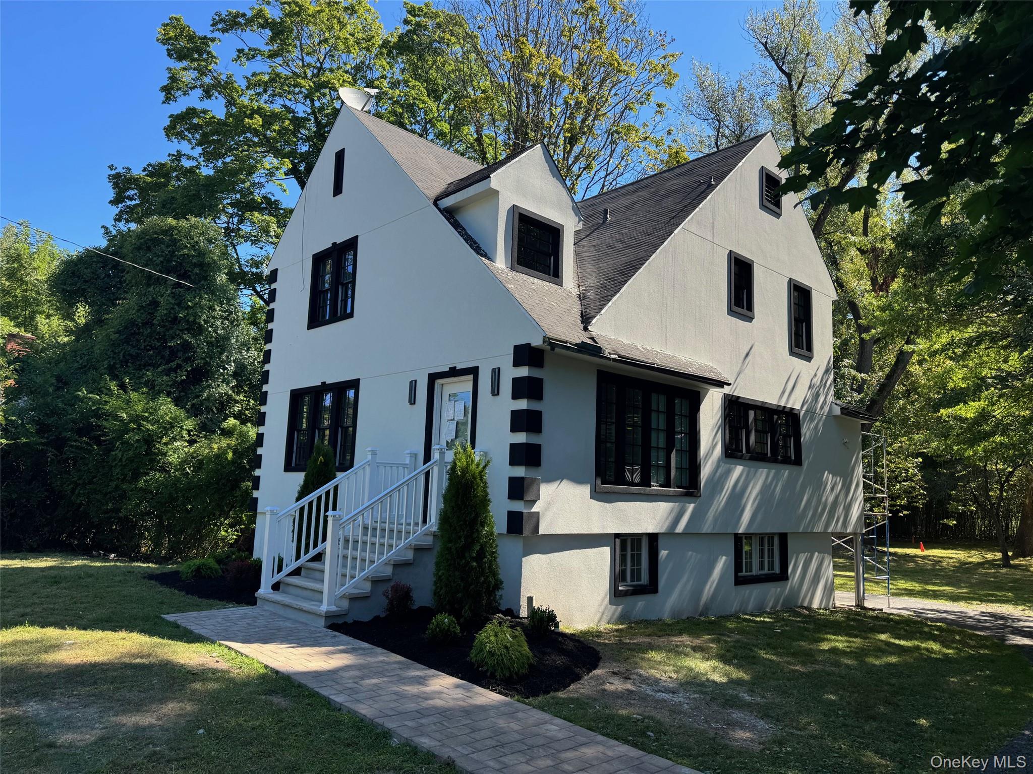 506 Midland Avenue Rye, NY 10580 - Photo 2 of 15 a front view of a house with a yard