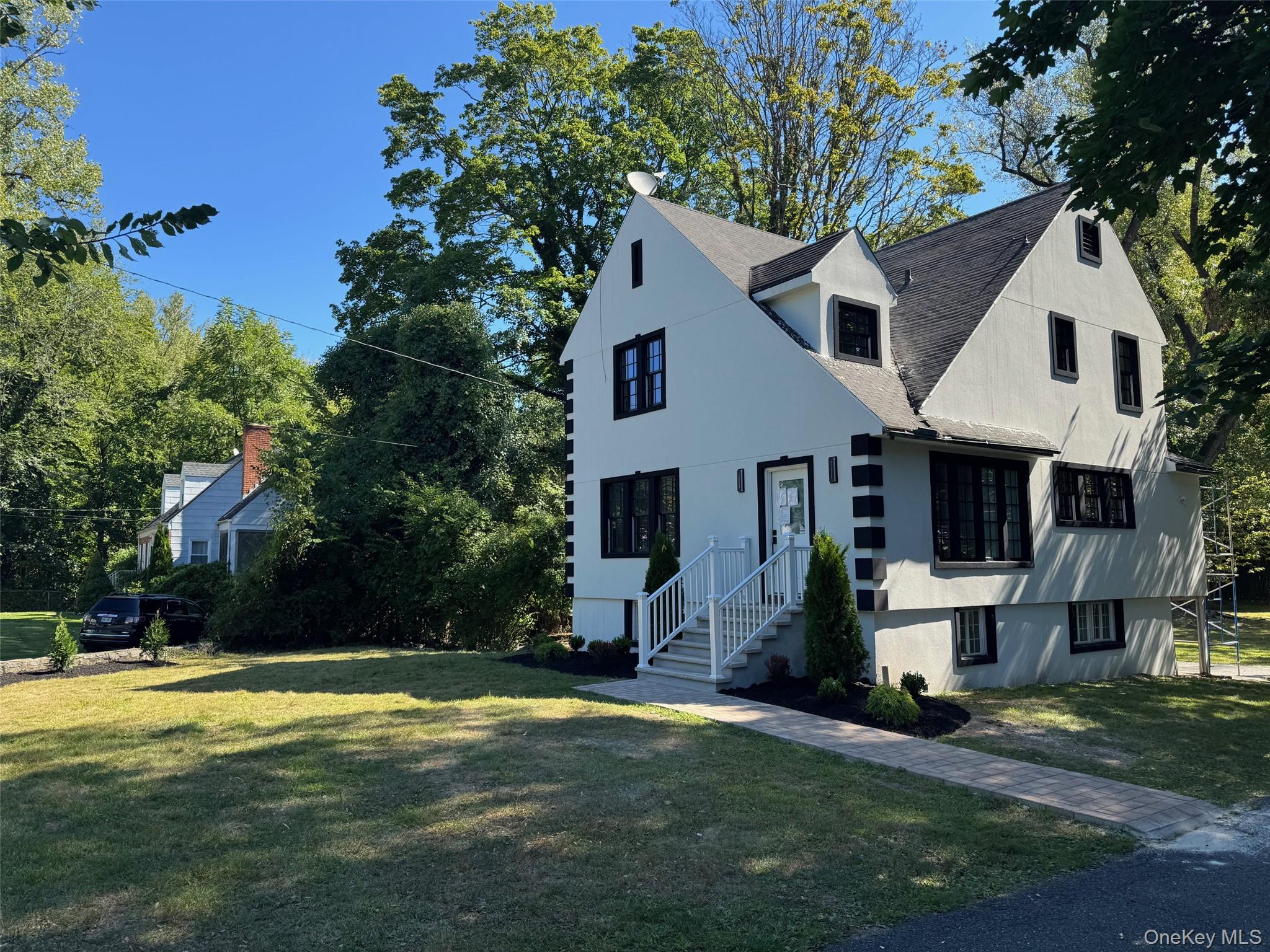 506 Midland Avenue Rye, NY 10580 - Photo 3 of 15 a front view of a house with a yard