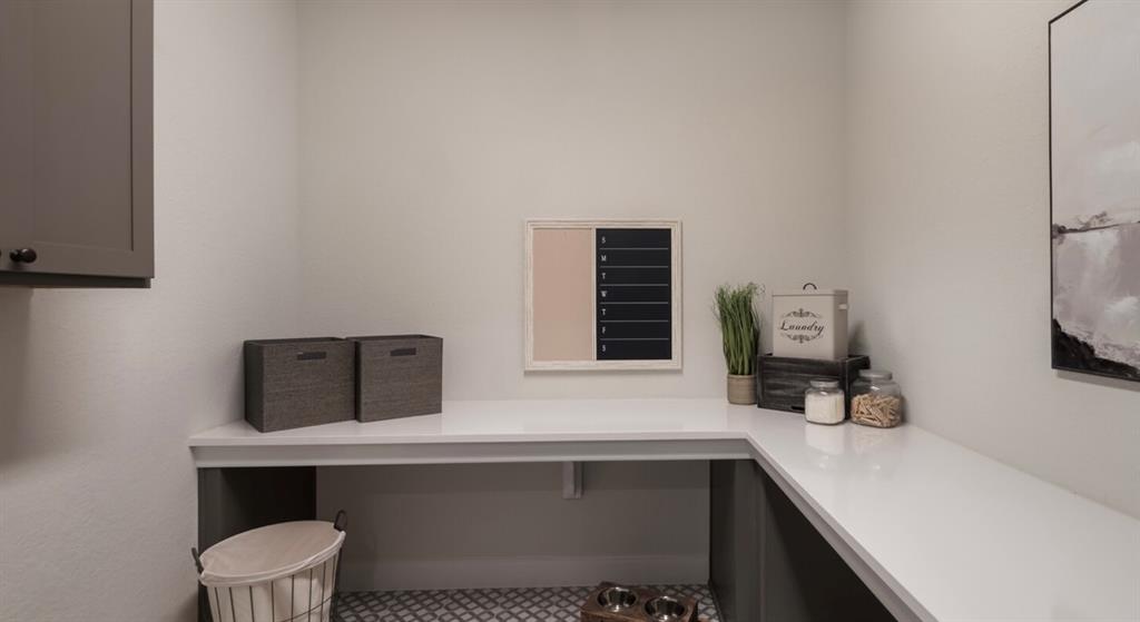 Lot 12 Ridgeway Trail Johnson City, TX 78636 - Photo 14 of 26 a room with a table chairs and a wooden floor