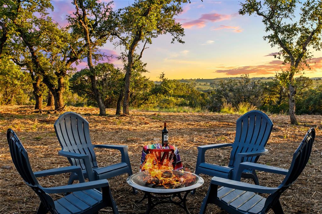 Lot 12 Ridgeway Trail Johnson City, TX 78636 - Photo 22 of 26 a view of a chairs and table in patio