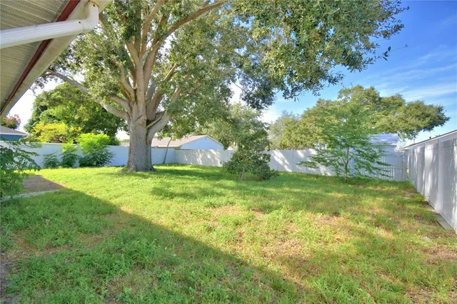 a backyard of a house with lots of green space
