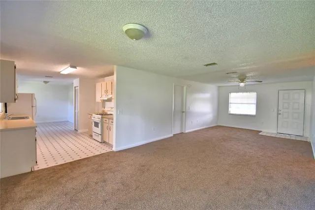 a view of a livingroom with a furniture and window