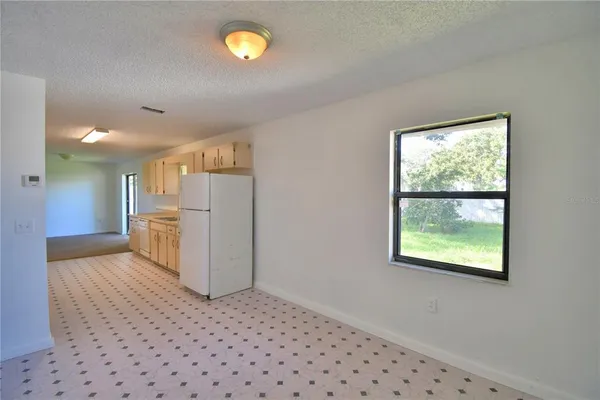 a view of a kitchen with a window