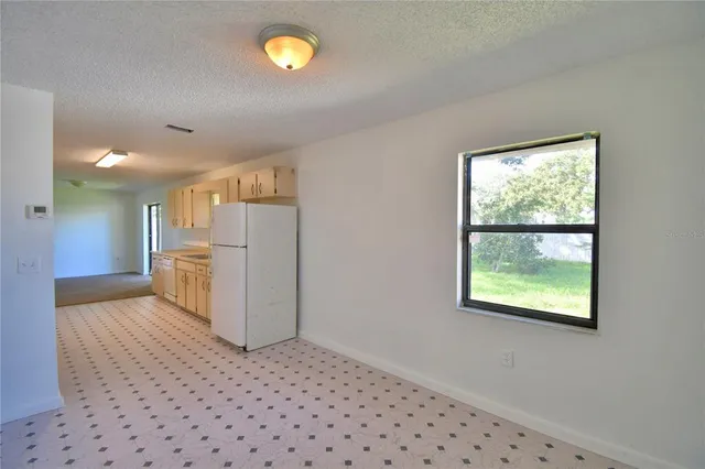 a view of a kitchen with a window