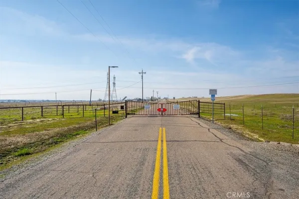 a view of a street with an ocean view