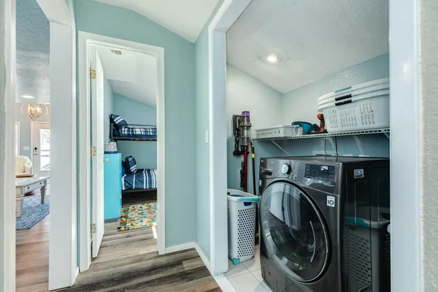 a view of a hallway with washer and dryer