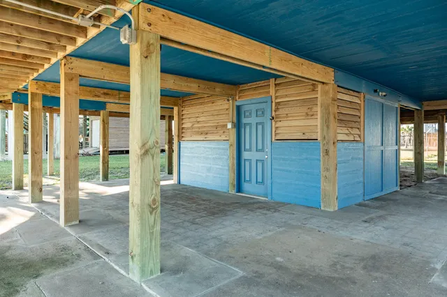 a view of a brick building next to a yard