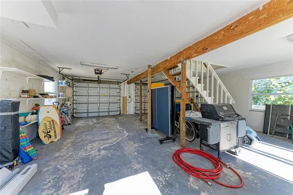 a view of a chairs and table in patio with potted plants
