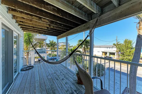 a view of a balcony with chairs