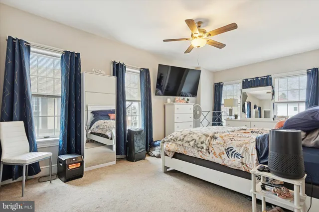 a bed room with a bed and a chandelier