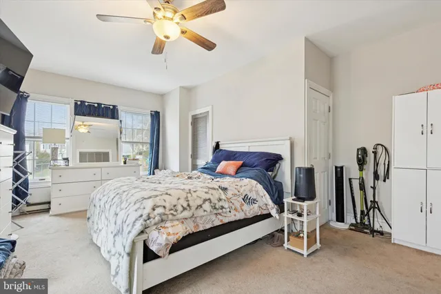 a view of a bathroom with dual sinks