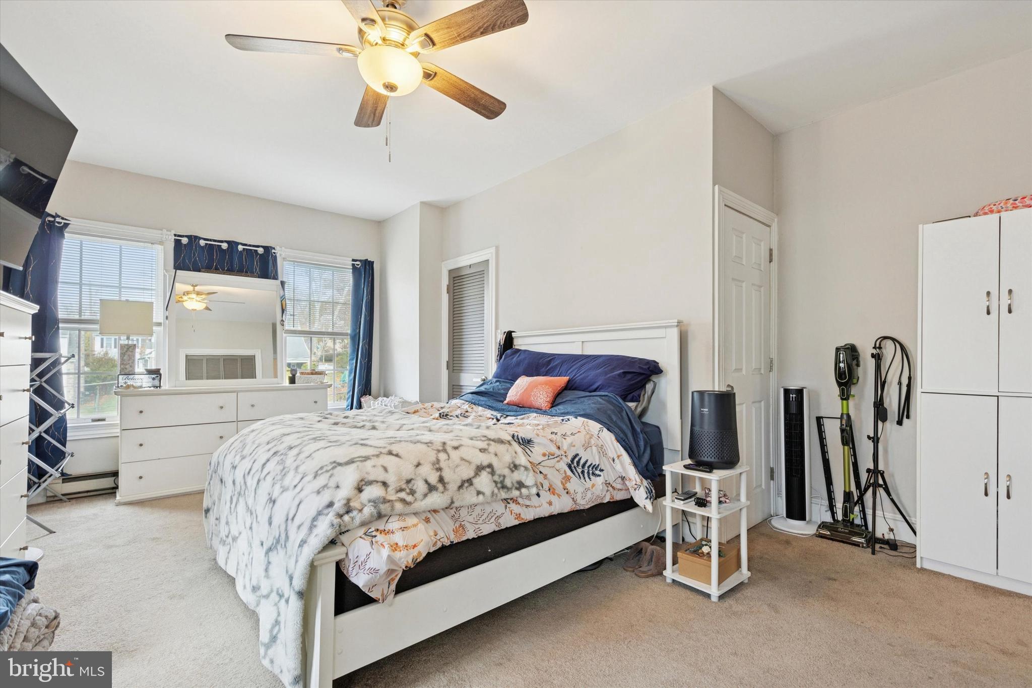 641 East High Street, Unit 2 Pottstown, PA 19464 - Photo 12 of 15 a bed room with a bed and a chandelier