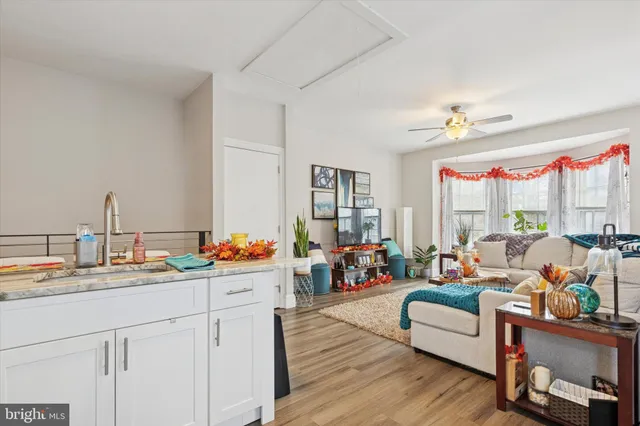 a very nice looking room with a large window and furniture