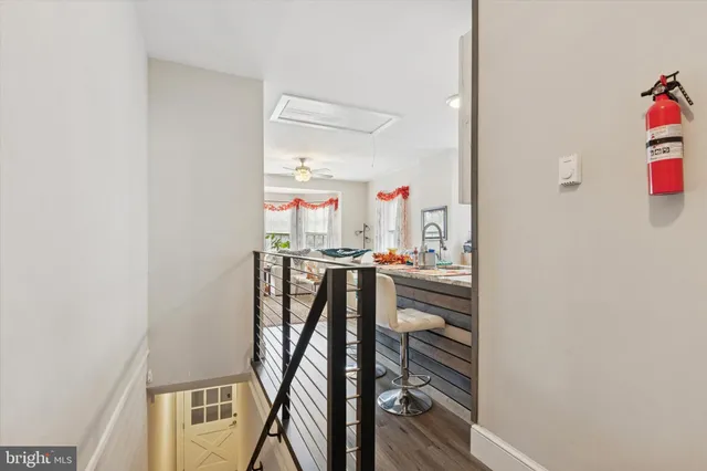a kitchen with stainless steel appliances a refrigerator sink and microwave