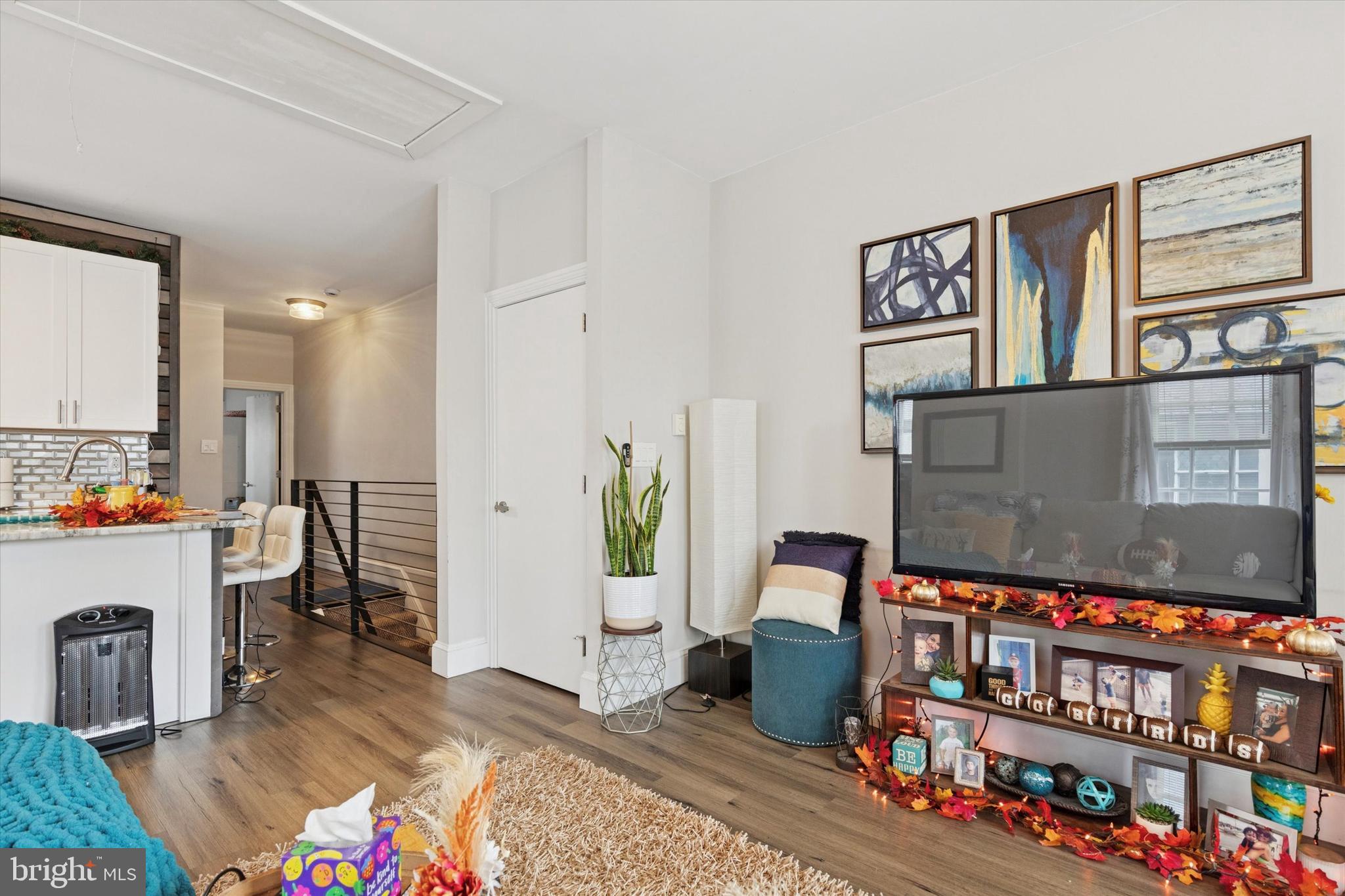 641 East High Street, Unit 2 Pottstown, PA 19464 - Photo 6 of 15 a living room with lots of furniture and a book shelf