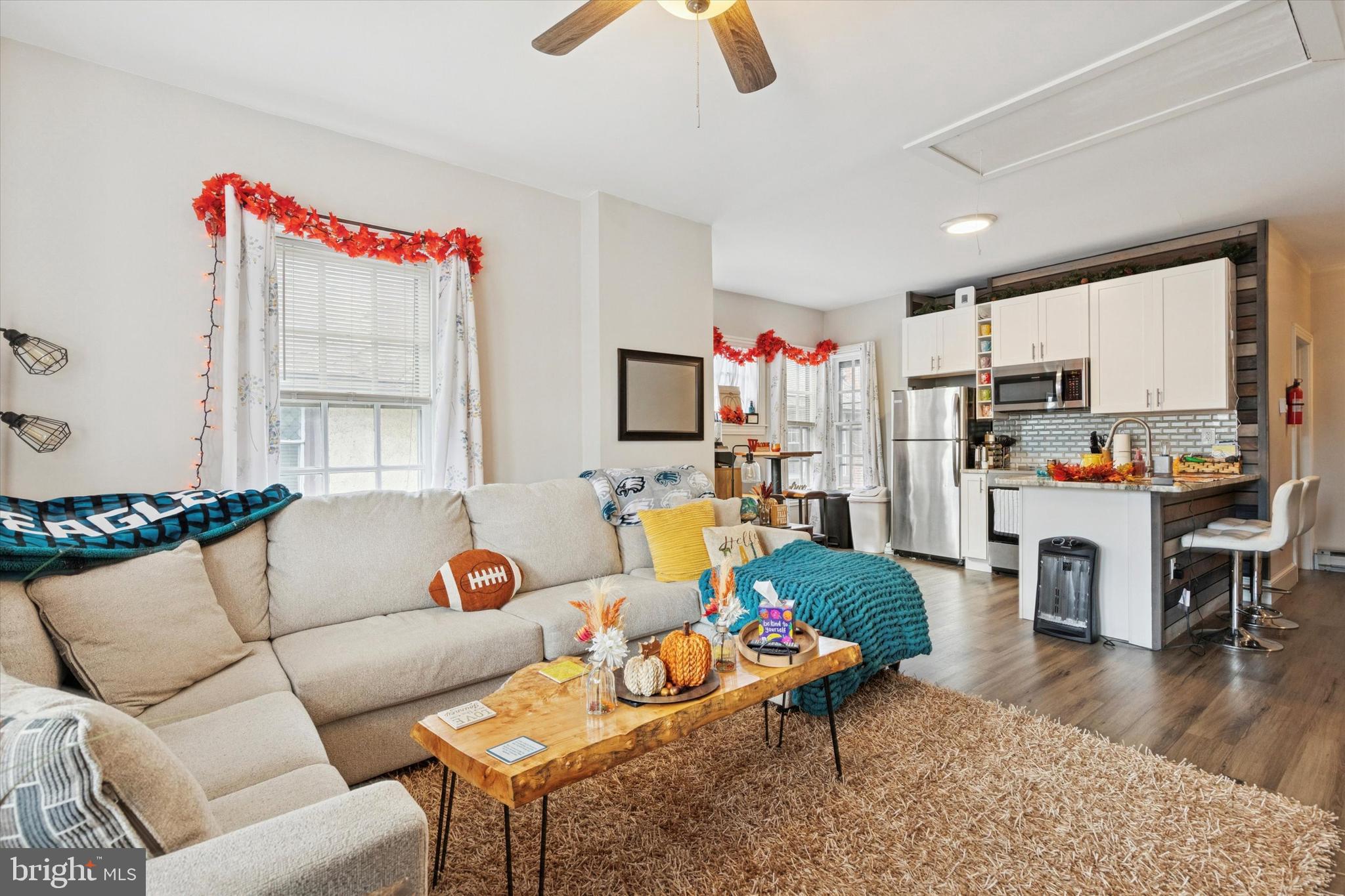 641 East High Street, Unit 2 Pottstown, PA 19464 - Photo 9 of 15 a living room with furniture and a kitchen view