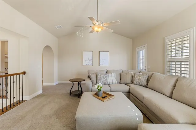 a bathroom with a granite countertop sink and shower