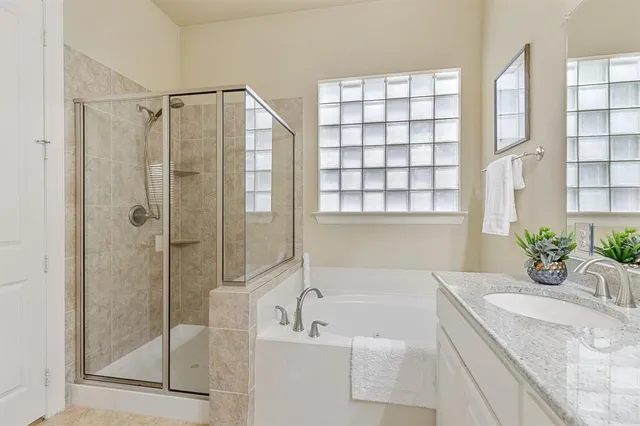 a bedroom with two beds and a chandelier