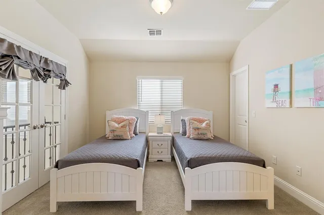 a bedroom with a bed and a night stand