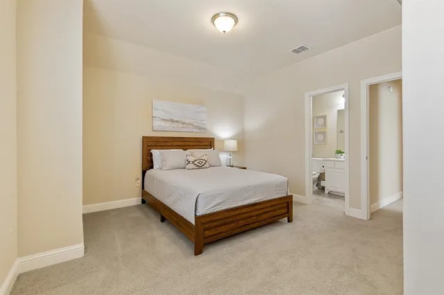 a bed room with a bed and a night stand