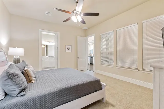 a room with a bed and a flat screen tv