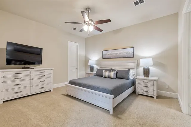 a bathroom with a sink toilet a mirror a vanity and shower