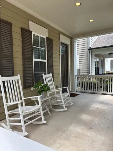 a view of a chair and table in the back yard