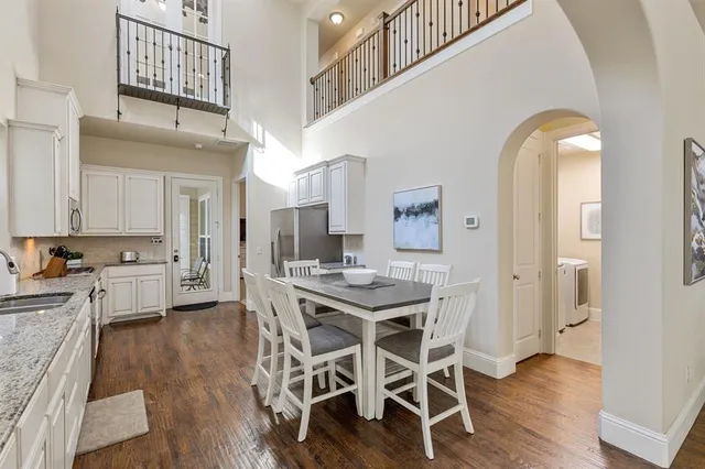 a view of a kitchen with workspace and wooden floor