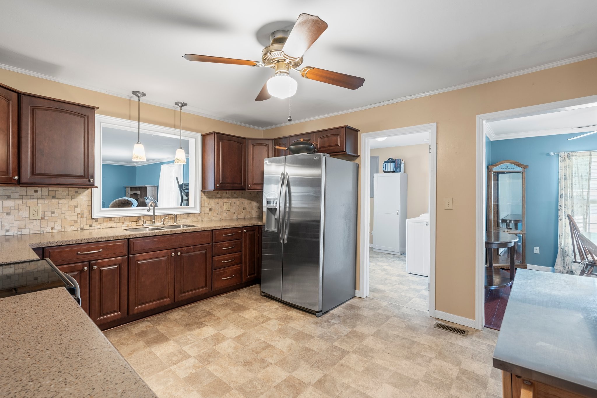 4239 Sixteenth Model Road Manchester, TN 37355 - Photo 17 of 56 a large kitchen with cabinets and stainless steel appliances