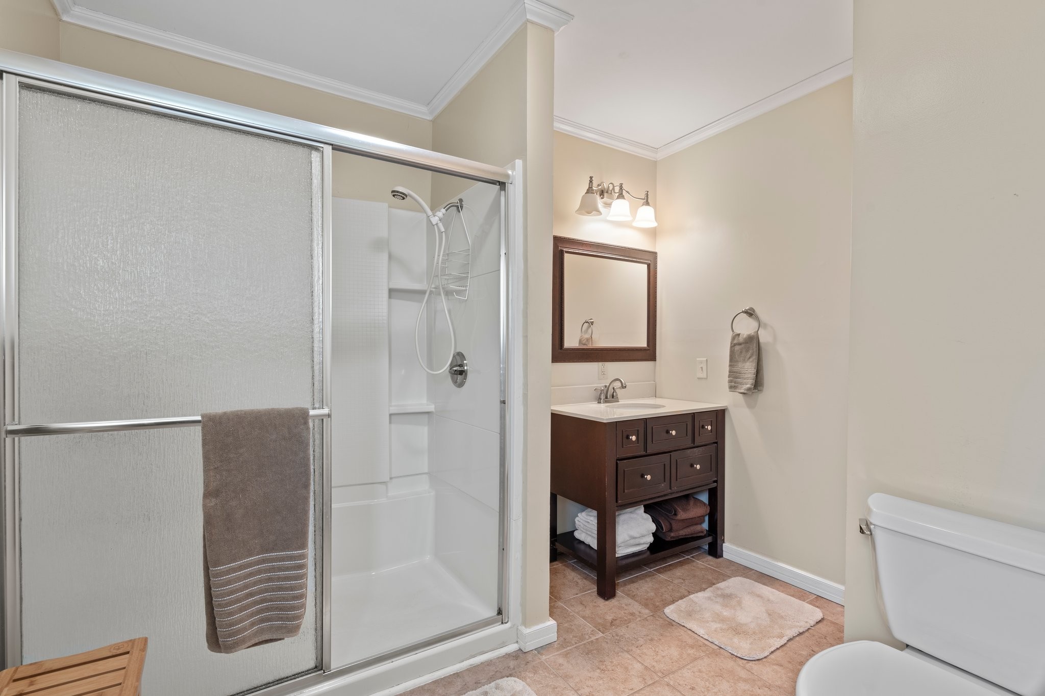 4239 Sixteenth Model Road Manchester, TN 37355 - Photo 26 of 56 a bathroom with a sink mirror and shower
