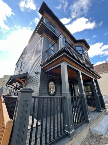 a view of a wooden house with a large door