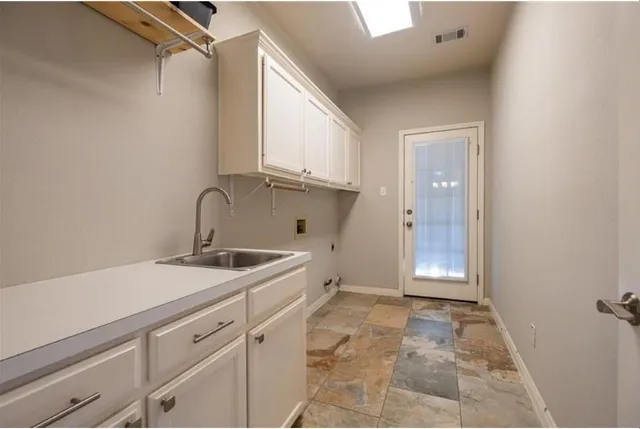 a bathroom with a granite countertop sink a toilet and a mirror