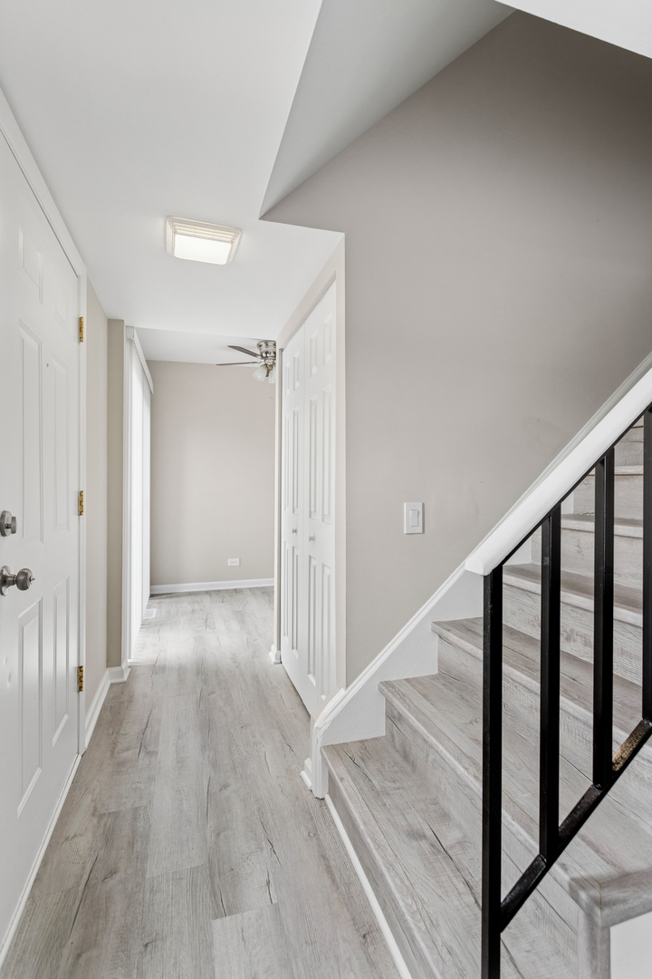 4 Tower Court Downers Grove, IL 60516 - Photo 11 of 20 a view of a hallway with wooden floor and entryway