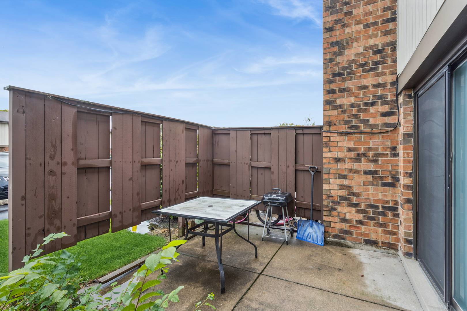 4 Tower Court Downers Grove, IL 60516 - Photo 18 of 20 a backyard of a house with table and chairs