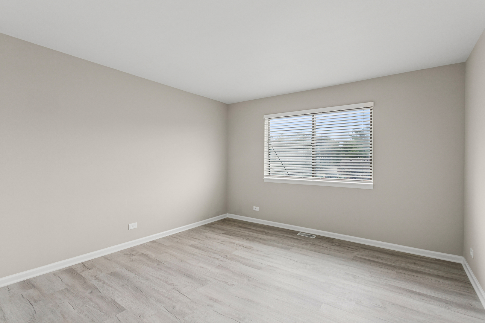 4 Tower Court Downers Grove, IL 60516 - Photo 4 of 20 an empty room with a window